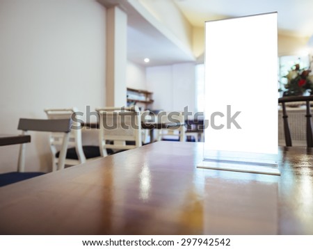 Mock up Menu frame on Table in restaurant cafe Background
