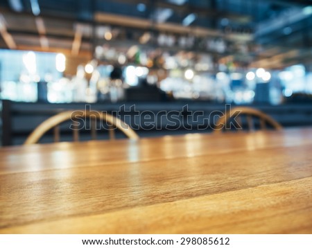 Table Top Wooden Counter with blurred Bar Restaurant background