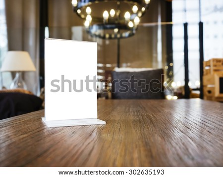 Mock up Menu frame on Table with Restaurant Cafe Shop Interior Background