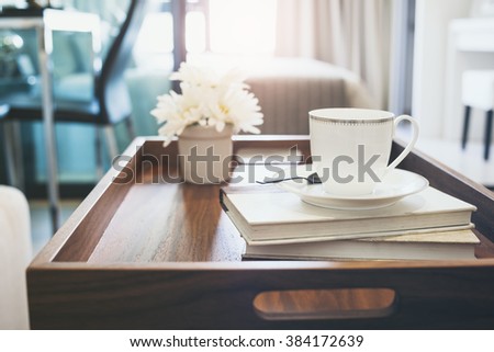 Home Interior with Coffee cup Books white flower on table wooden tray lifestyle background