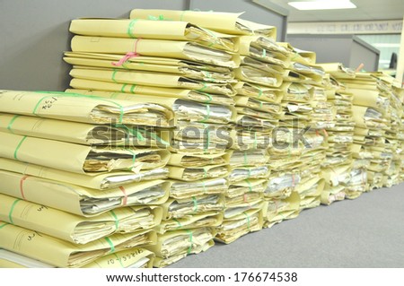 Stack Of Tied Old Files Yellowing On Office Floor