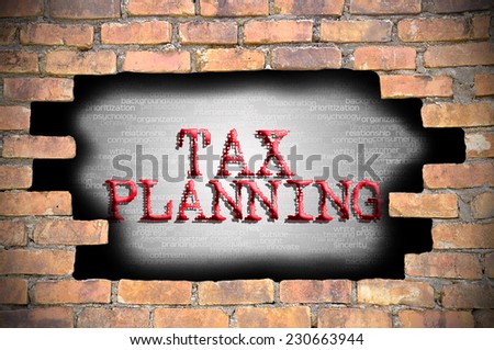 Business Concept - Hole At The Brick Wall And Found Caption Tax Planning Inside The Wall.