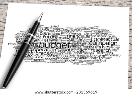 Close Up Pen And Paper On The Wooden Table With Budget Word Cloud And Its Related.