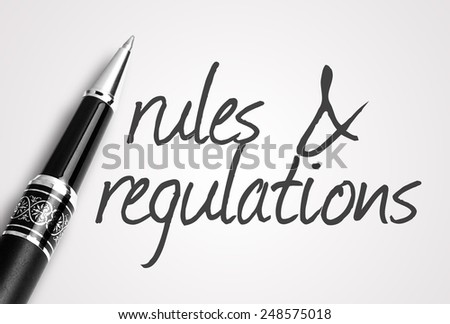pen writes rules & regulations  on paper
