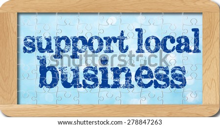 jigsaw puzzle of support local business in wooden frame.