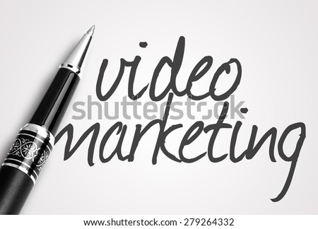 pen writes video marketing on paper.