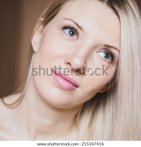Portrait of beautiful blond woman with natural makeup, head shot
