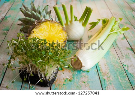 fresh organic vegetables and fruit variety on wooden floor