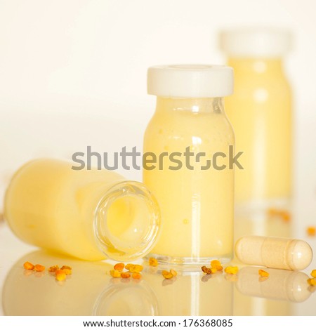 raw organic royal jelly in a small bottle