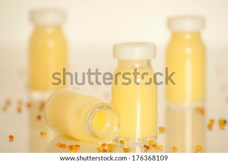 raw organic royal jelly in a small bottle