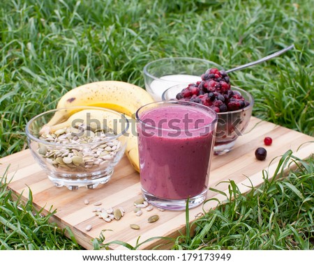 healthy berries juice smootie on wooden board