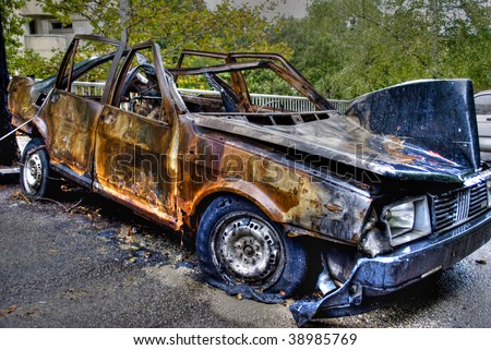 stock photo abandoned burnt rusted car a terrorism act rusted car