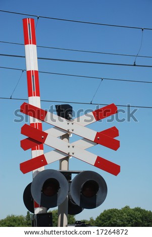 railway sign and traffic lights at a railroad crossing