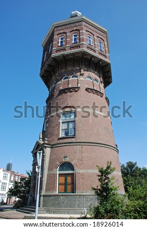 old fashioned water tower used for transporting drinking water, now a family home