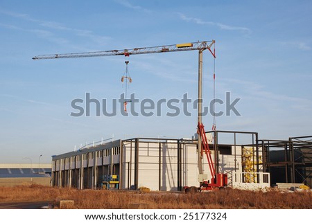 Building development new business premises with the help of a hoisting crane