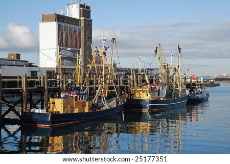 Trawlers moored in the dutch harbor Breskens on sunday, the day of rest.