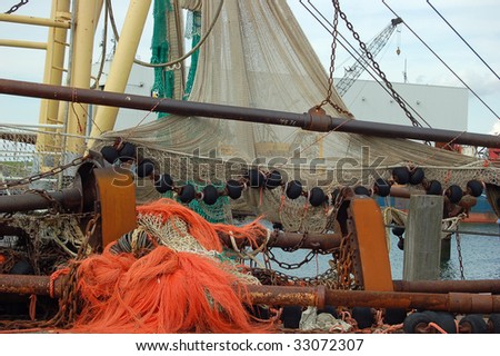 colorful fishing nets hanging drying o a fishing ship