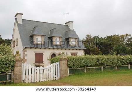 Pretty little house with gate and hedge