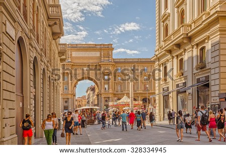 Florence, Italy - 14 September 2014: Florence, Italy - 14 September 2014: The street leading to the Arch in honor of King Victor Emmanuel and Pillar 2 of Plenty at the Republic Square in Florence.