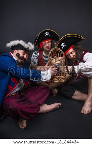 Three pirates with the golden cage