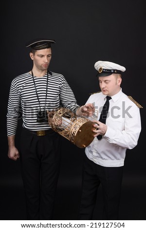 Captain and sailor with the golden cage