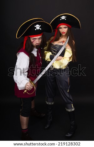 Scarface pirate with a sword and girl pirate