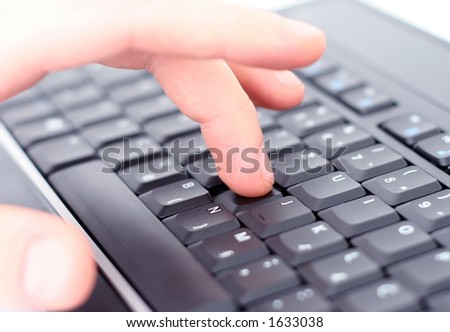 Hand on keyboard, shallow DOF