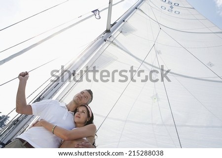 Happy young people relaxing on yeacht on sea