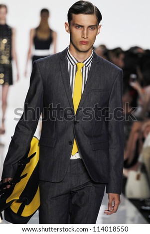 NEW YORK SEPTEMBER 12 Male model walks the runway at the Michael Kors S S 2013 collection presentation during Mercedes-Benz Fashion Week on September 12 2012 in New York NEW YORK SEPTEMBER 12 Male model walks the runway at the Michael Kors S S 2013 collection presentation during Mercedes-Benz Fashion Week on September 12 2012 in New York
