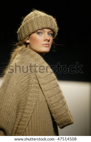 NEW YORK - FEBRUARY 17: A model walks the runway at the Michael Kors Collection for Fall/Winter 2010 during Fashion Week on February 17, 2010 in New York