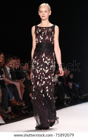 NEW YORK - FEBRUARY 14: Top model Ginta Lapina walks the runway at the Carolina Herrera Fall 2011 Collection presentation during Mercedes-Benz Fashion Week on February 14, 2011 in New York.