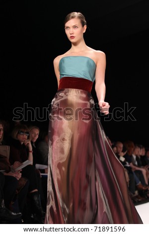 NEW YORK - FEBRUARY 14: Top model Karlie Kloss walks the runway at the Carolina Herrera Fall 2011 Collection presentation during Mercedes-Benz Fashion Week on February 14, 2011 in New York.
