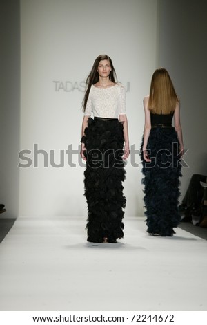 NEW YORK - FEBRUARY 10: Model walks the runway at the Tadashi Shoji Fall 2011 Collection presentation during Mercedes-Benz Fashion Week on February 14, 2011 in New York.