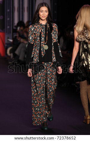 NEW YORK - FEBRUARY 16: Model Liu Wen walks the runway at the Anna Sui Fall 2011 Collection presentation during Mercedes-Benz Fashion Week on February 16, 2011 in New York.