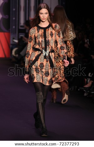 NEW YORK - FEBRUARY 16: Top model Karlie Kloss walks the runway at the Anna Sui Fall 2011 Collection presentation during Mercedes-Benz Fashion Week on February 16, 2011 in New York.