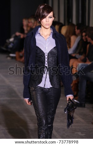 NEW YORK - FEBRUARY 15: Model Britt Maren walks the wooden runway at the DIESEL BLACK GOLD  Fall 2011 Collection presentation during Mercedes-Benz Fashion Week on February 15, 2011 in New York.