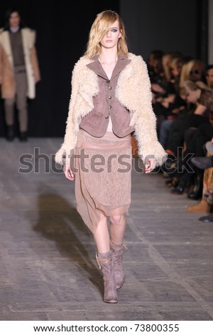 NEW YORK - FEBRUARY 15: Top model Daria Strokous walks the wooden runway at the DIESEL BLACK GOLD Fall 2011 Collection presentation during Mercedes-Benz Fashion Week on February 15, 2011 in New York.