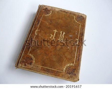 Old leather-bound book with white background