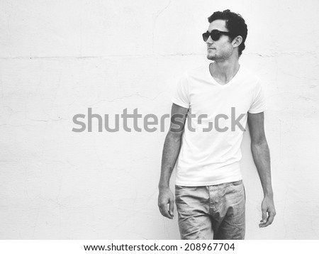 young man with jeans and grunge background