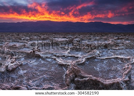 Fiery sunset over Badwater, the lowest point in the United States, California's Death Valley National Park.