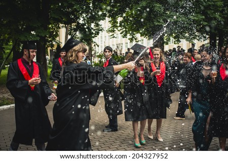 Kiev, Ukraine - June 4: Students in mantle celebrating near the National State Tax Service University of Ukraine June 4, 2014 in Kiev, Ukraine