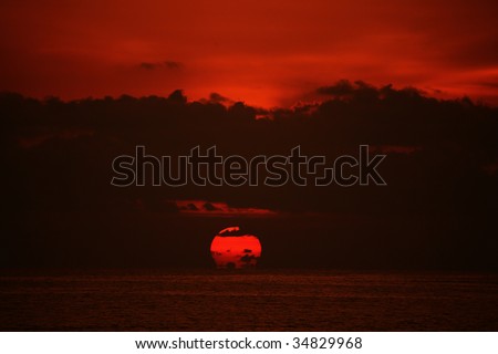 Sunset at the sea with red and orange background in landscape orientation