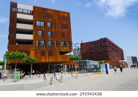VIENNA, AUSTRIA, June 13, 2015: Vienna University of Economics and Business. Futuristic architecture designed by architect Zaha Hadid. Wirtschaftsuniversitat Wien WU. People and Students near campus.
