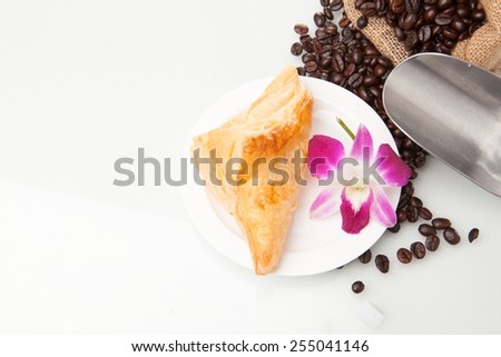 Bakery with coffee beans and flower Orchid and pie isolated on white background.