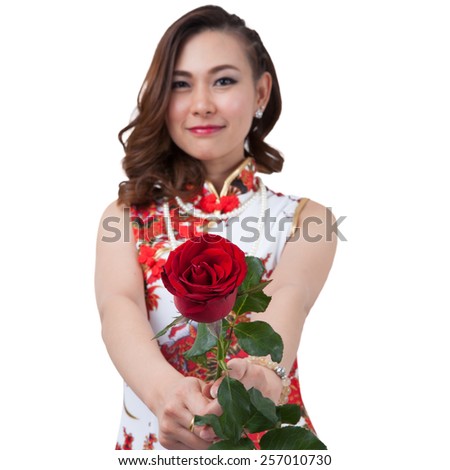 Chinese woman in cheongsam of traditional Chinese dress and holding a fresh cut rose  romance love, Portrait isolated on white background.