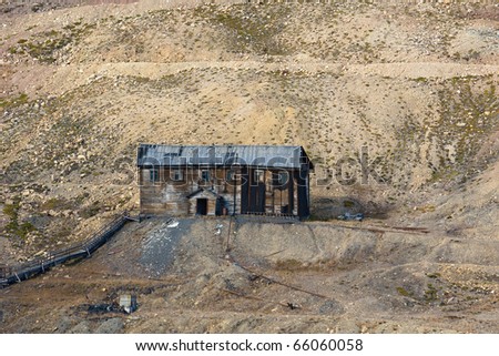 Worn down house in the deserted russian mining town Pyramiden. Isfjorden, Longyearbyen, Svalbard, Spitsbergen, Norway.