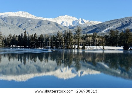 Perfect Reflection of Mountains in Lac Beauvert, Jasper National Park, Alberta, Canada