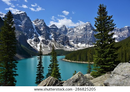 Horizontal Image of  Morraine Lake Surrounded by High Mountain Peaks in the Canadian Rockies