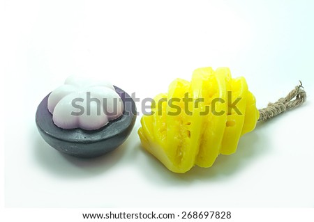 Natural handmade soaps, fancy fruit on a white background.