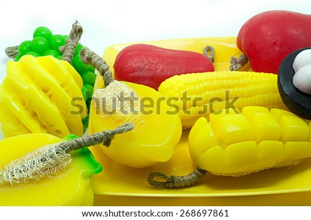 Natural handmade soaps, fancy fruit on a white background.